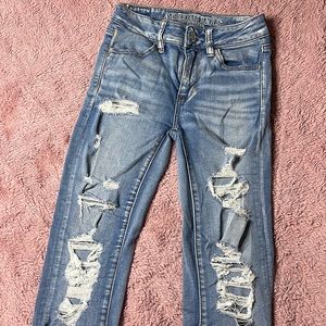 AEO NEXT LEVEL STRETCH RIPPED JEANS